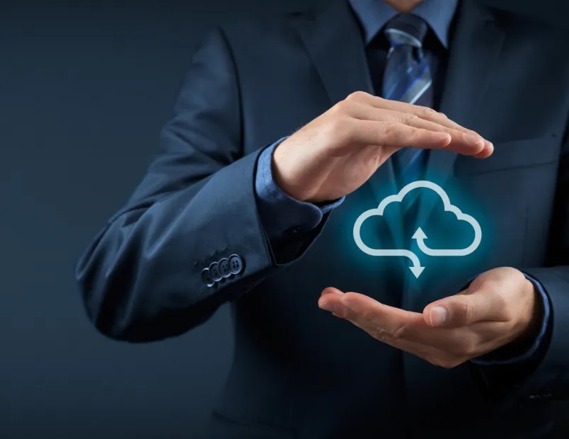 A woman standing in a room filled with servers, representing cloud consulting services.